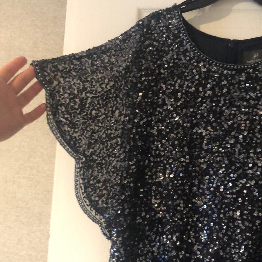 Navy blue, sequin and beaded cape sleeve dress. Knee length. Formal wear